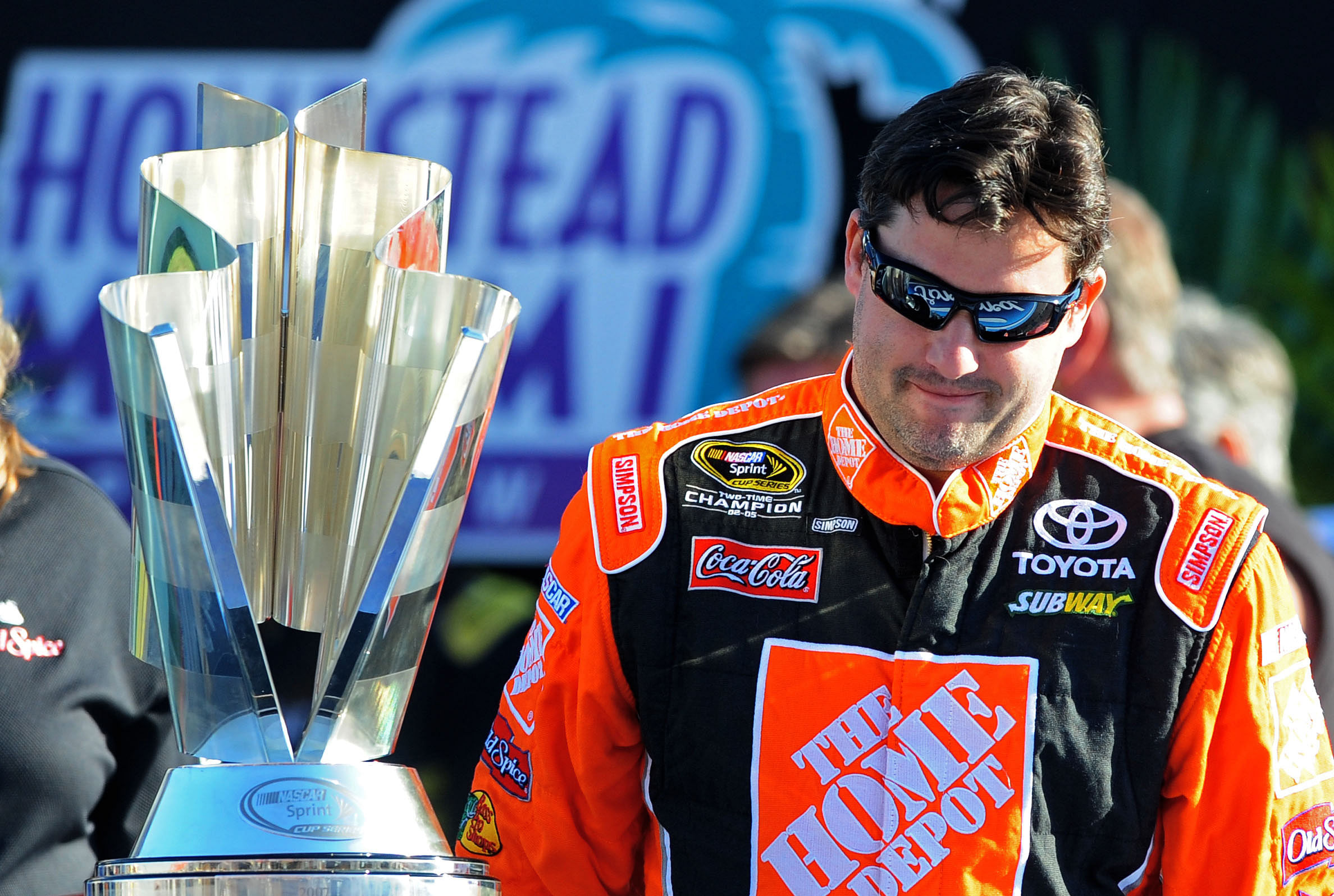 NASCAR Sprint Cup Series former champion Tony Stewart walks by the 2008 championship at Homestead-Miami. Source: Imagn